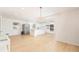 Modern kitchen with stainless steel appliances, island, and white cabinets at 1502 Campground Rd, Mcdonough, GA 30252