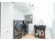 Functional laundry room with modern appliances and a utility sink at 1502 Campground Rd, Mcdonough, GA 30252