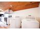 Laundry room with wood ceiling and updated appliances at 1502 Campground Rd, Mcdonough, GA 30252