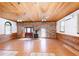 Open-concept living space featuring wood accents, brick details, fireplace, and natural light at 1502 Campground Rd, Mcdonough, GA 30252