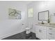Contemporary bathroom with marble floors, white vanity, modern fixtures, and minimalist design at 2060 North Avenue Nw, Atlanta, GA 30318