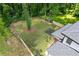 Aerial view showcasing the home's expansive and well-maintained backyard enclosed by a wooden fence at 2060 North Avenue Nw, Atlanta, GA 30318