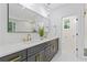 Modern bathroom with double vanity, marble countertops, and stylish gold fixtures and accents throughout at 2060 North Avenue Nw, Atlanta, GA 30318
