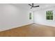 Bright, empty bedroom with hardwood floors, ceiling fan, and ample natural light at 2060 North Avenue Nw, Atlanta, GA 30318