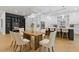 Dining area adjacent to the kitchen with hardwood floors, a wooden table, and modern furnishings at 2060 North Avenue Nw, Atlanta, GA 30318