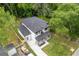 Beautiful two-story home with a lush green lawn, inviting brick porch, and a modern garage at 2060 North Avenue Nw, Atlanta, GA 30318