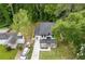 Aerial view of a modern home with a manicured lawn and a driveway at 2060 North Avenue Nw, Atlanta, GA 30318