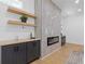 Modern living room featuring a fireplace with tiled wall and floating shelves at 2060 North Avenue Nw, Atlanta, GA 30318