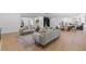 Spacious open-concept living room with hardwood floors and stylish furniture at 2060 North Avenue Nw, Atlanta, GA 30318