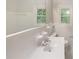 Clean bathroom featuring white fixtures, vanity, and a tiled shower-tub combination at 2584 Favor Sw Rd, Marietta, GA 30060