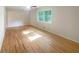 Sun-drenched bedroom with hardwood floors, neutral walls, and bright window at 2584 Favor Sw Rd, Marietta, GA 30060