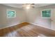 Well-lit bedroom featuring hardwood floors, fresh paint, and lots of natural light at 2584 Favor Sw Rd, Marietta, GA 30060