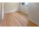 Well-lit bedroom featuring hardwood floors, fresh paint, and natural light at 2584 Favor Sw Rd, Marietta, GA 30060