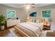 Bright, staged bedroom with large bed, modern furniture, and natural light at 2584 Favor Sw Rd, Marietta, GA 30060