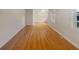 Bright hallway featuring gleaming hardwood floors, fresh paint, and an open layout at 2584 Favor Sw Rd, Marietta, GA 30060
