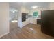 Cozy kitchen featuring white cabinets, updated appliances, and laminate flooring at 2584 Favor Sw Rd, Marietta, GA 30060
