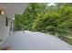 Exterior shot of a back porch with surrounding greenery and rod iron fence and pergola at 2683 Tritt Springs Ne Trce, Marietta, GA 30062