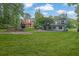 Expansive backyard featuring a lush lawn, patio area, and mature trees for privacy at 2683 Tritt Springs Ne Trce, Marietta, GA 30062