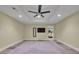 Finished basement with plush carpeting, recessed lighting, TV, and open layout, suitable for recreation at 2683 Tritt Springs Ne Trce, Marietta, GA 30062