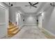 Spacious basement with slate-style tile, rug, ceiling fan, recessed lighting, and staircase at 2683 Tritt Springs Ne Trce, Marietta, GA 30062