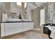 Elegant bathroom featuring double sinks, modern vanity, sleek fixtures, and a glass-enclosed shower at 2683 Tritt Springs Ne Trce, Marietta, GA 30062