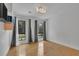 Sunlit bedroom with hardwood floors, neutral walls, and large windows overlooking a manicured lawn at 2683 Tritt Springs Ne Trce, Marietta, GA 30062