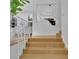Bright entryway features light wood floors, modern railings, and minimalist decor at 2683 Tritt Springs Ne Trce, Marietta, GA 30062