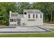 Stunning home featuring modern architecture, a landscaped yard, and a unique decorative rock border at 2683 Tritt Springs Ne Trce, Marietta, GA 30062