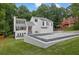 A modern home with a landscaped yard featuring decorative rock and lush green grass at 2683 Tritt Springs Ne Trce, Marietta, GA 30062