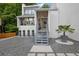 Modern home featuring a front entrance with meticulous stone landscaping and mature trees at 2683 Tritt Springs Ne Trce, Marietta, GA 30062