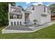 Modern home with stone landscaping, mature trees, and a welcoming entrance at 2683 Tritt Springs Ne Trce, Marietta, GA 30062