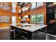 A gourmet kitchen includes a large island with cooktop, ample counter space, seating, and great views of the outdoors at 2683 Tritt Springs Ne Trce, Marietta, GA 30062