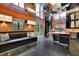 Modern kitchen features black cabinets, stainless steel appliances, built in bench, and sliding doors to the outside at 2683 Tritt Springs Ne Trce, Marietta, GA 30062