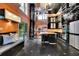 A spacious kitchen features black cabinets, stainless appliances, mirrored ceiling, and opens to the outdoor patio at 2683 Tritt Springs Ne Trce, Marietta, GA 30062