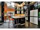 Modern kitchen features black cabinets, stainless steel appliances, and a mirrored ceiling for a sleek, contemporary design at 2683 Tritt Springs Ne Trce, Marietta, GA 30062