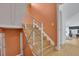 The staircase boasts a modern design with wooden steps, metal railings, and abundant natural light at 2683 Tritt Springs Ne Trce, Marietta, GA 30062
