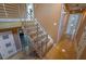 Modern staircase with stainless steel railings and wood steps, offering seamless transition at 2683 Tritt Springs Ne Trce, Marietta, GA 30062