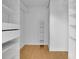 Spacious walk-in closet with custom shelving and storage options to maximize organization at 2683 Tritt Springs Ne Trce, Marietta, GA 30062