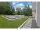 Manicured lawn, stone pathway and modern gravel landscaping create a parklike backyard at 2683 Tritt Springs Ne Trce, Marietta, GA 30062
