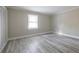Bedroom with wood-look floors, window, and closet at 6700 Roswell Rd # 21E, Sandy Springs, GA 30328