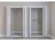 Organized walk-in closet with shelving; louvered doors at 6700 Roswell Rd # 21E, Sandy Springs, GA 30328