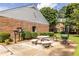 The inviting outdoor space is equipped with a barbecue grill, seating, and lush greenery for relaxation and entertainment at 6700 Roswell Rd # 21E, Sandy Springs, GA 30328