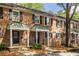 Charming brick townhomes with black shutters, awnings and inviting entryways, exuding timeless appeal at 6700 Roswell Rd # 21E, Sandy Springs, GA 30328