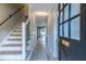Bright hallway with staircase and modern finishes showcasing the inviting interior at 6700 Roswell Rd # 21E, Sandy Springs, GA 30328