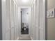 Hallway showing closet and bathroom with white paint and tiled floor at 6700 Roswell Rd # 21E, Sandy Springs, GA 30328