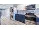 Updated kitchen with modern appliances and convenient washer and dryer area at 6700 Roswell Rd # 21E, Sandy Springs, GA 30328