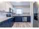 Updated kitchen with stainless appliances, light countertops, and two-toned cabinets at 6700 Roswell Rd # 21E, Sandy Springs, GA 30328