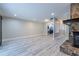 Living room featuring hardwood floors, fireplace, and access to the laundry area at 6700 Roswell Rd # 21E, Sandy Springs, GA 30328