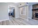 Living room showcases hardwood flooring, fireplace, and doorway to the kitchen at 6700 Roswell Rd # 21E, Sandy Springs, GA 30328