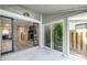 Covered patio with sliding glass doors leading to interior and exterior at 6700 Roswell Rd # 21E, Sandy Springs, GA 30328